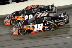 Joe Gibbs Racing teammates Denny Hamlin (20) and Kyle Busch combined to lead 128 of the races 147 laps. Credit: John Harrelson/Getty Images for NASCAR